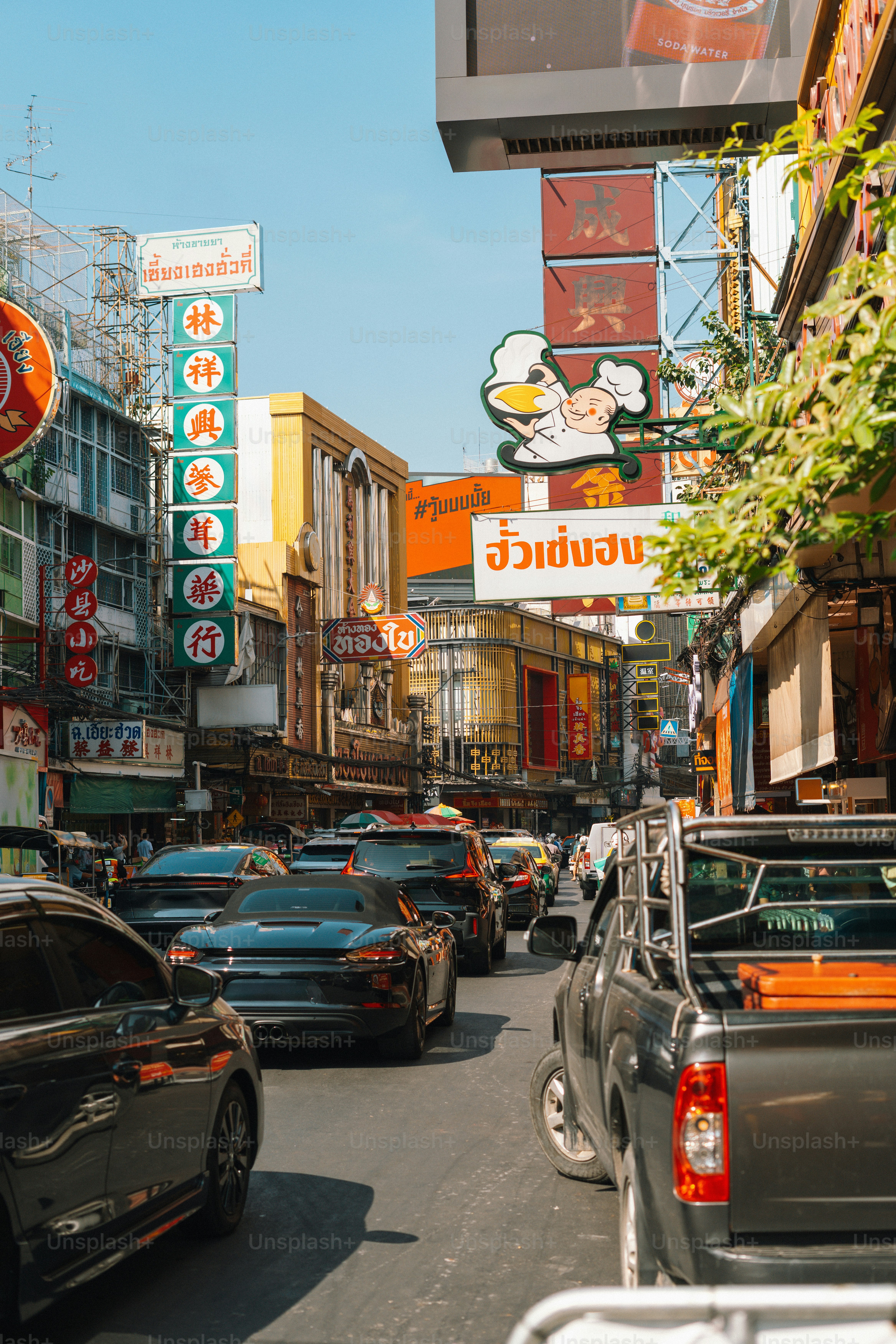 A busy street in a colorful asian city.